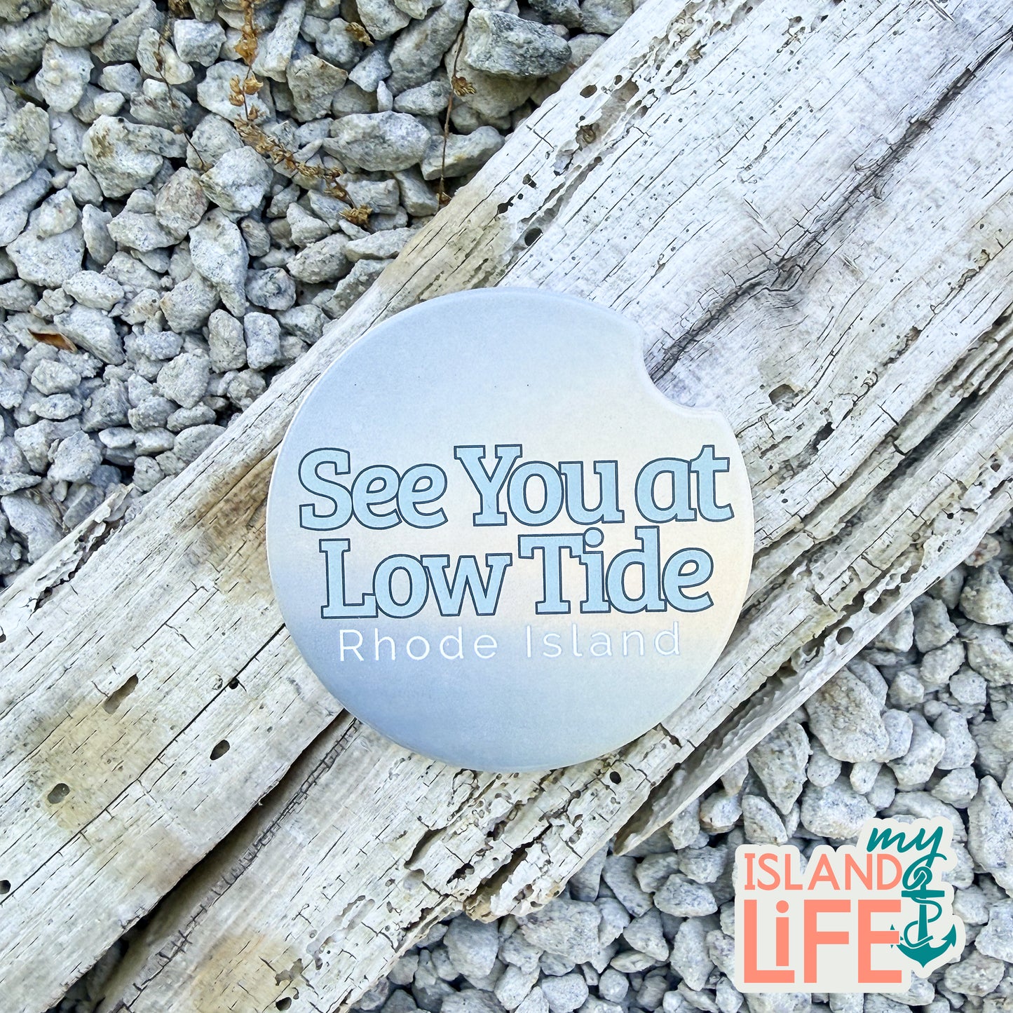 Round blue car coaster coaster with 'See You at Low Tide Rhode Island'
