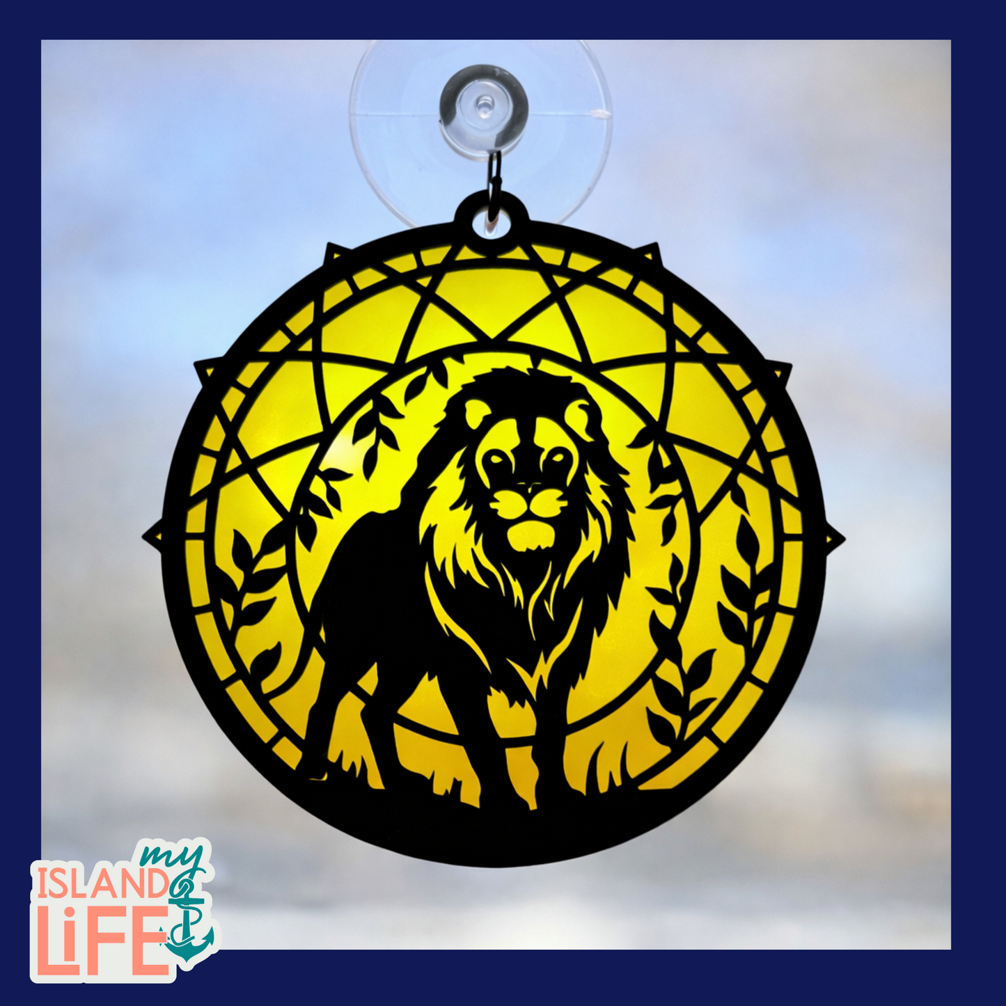 Decorative lion window hanging with yellow circle and 'My Island Life' logo.