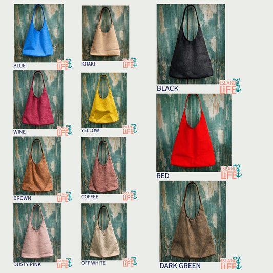 Collection of handbags in various colors on a textured wooden background with 'Island Life' branding.