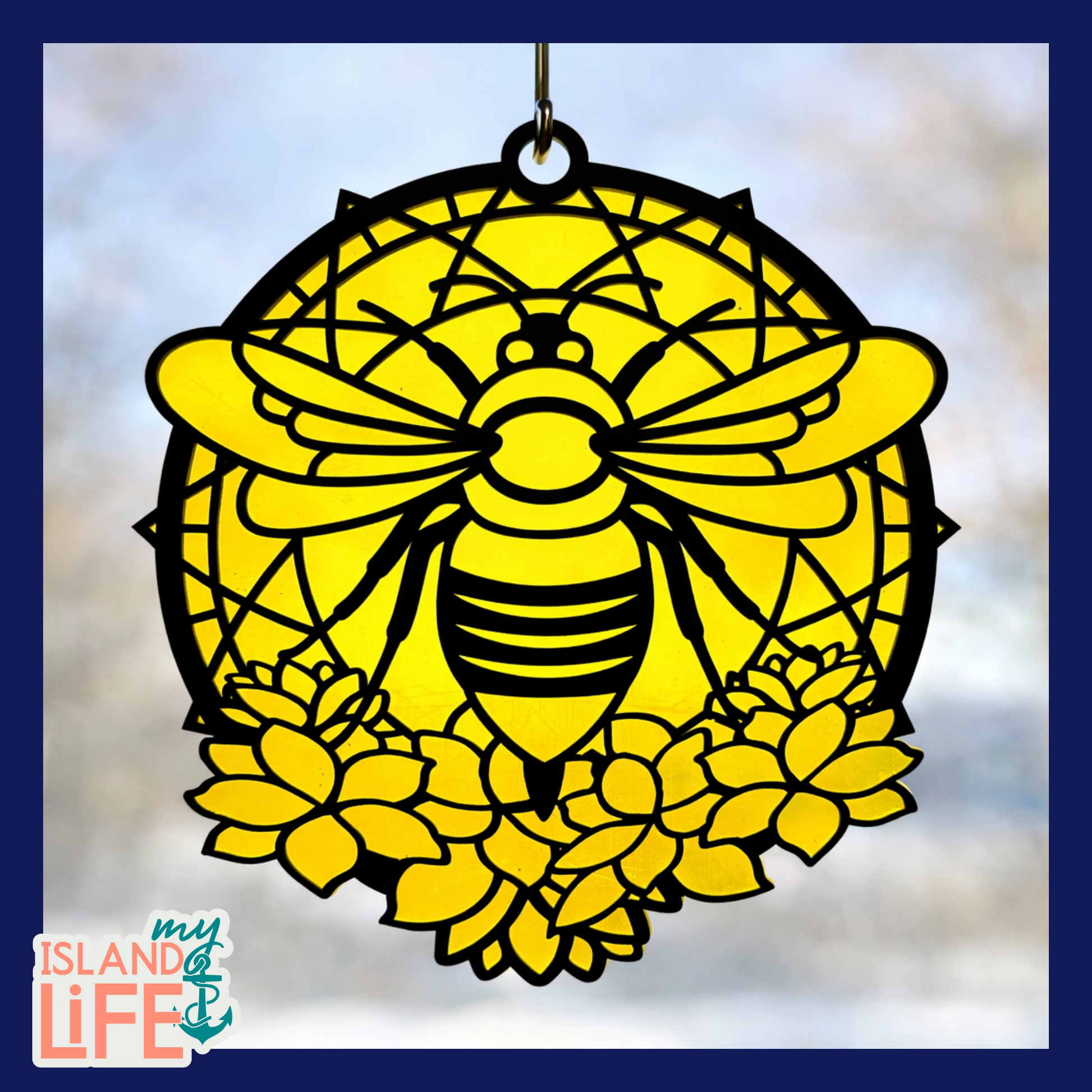 Decorative pink and black bird design with a suction cup on a light blue background.