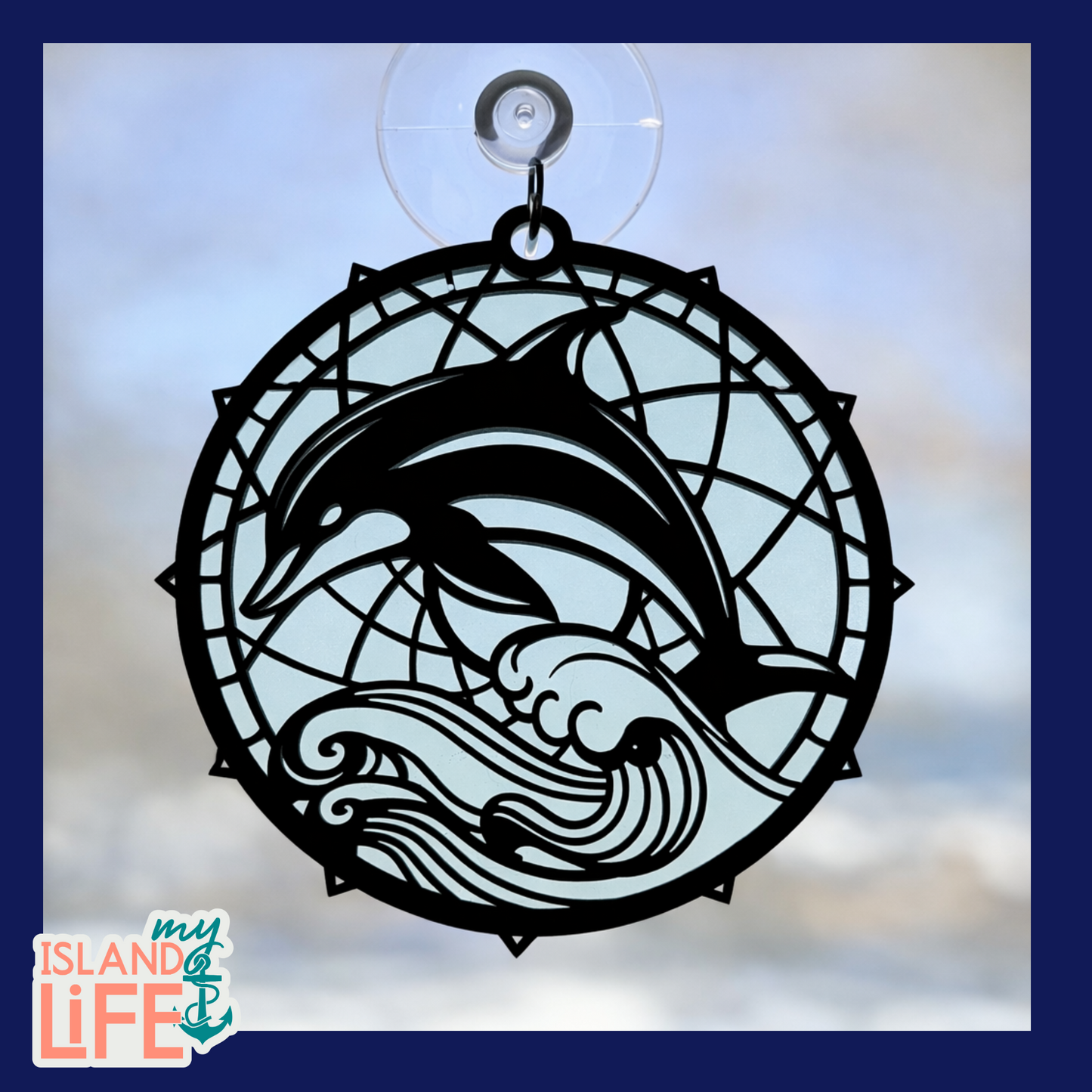 Decorative window hanging with dolphins and waves design, featuring 'My Island Life' logo.