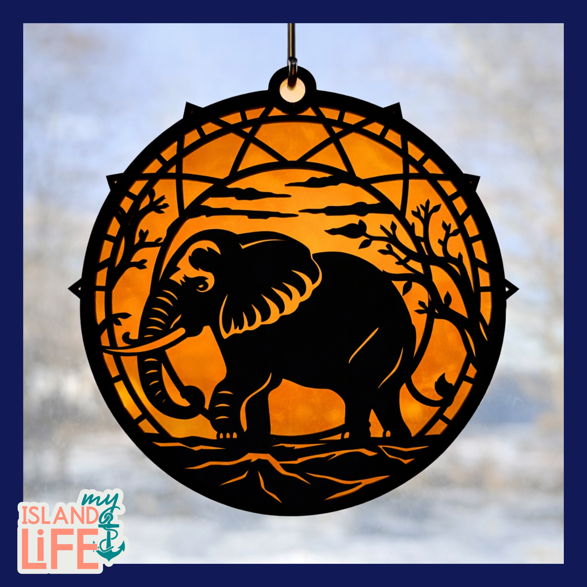 Decorative suncatcher with an elephant design on an orange background, featuring 'my ISLAND life' logo.