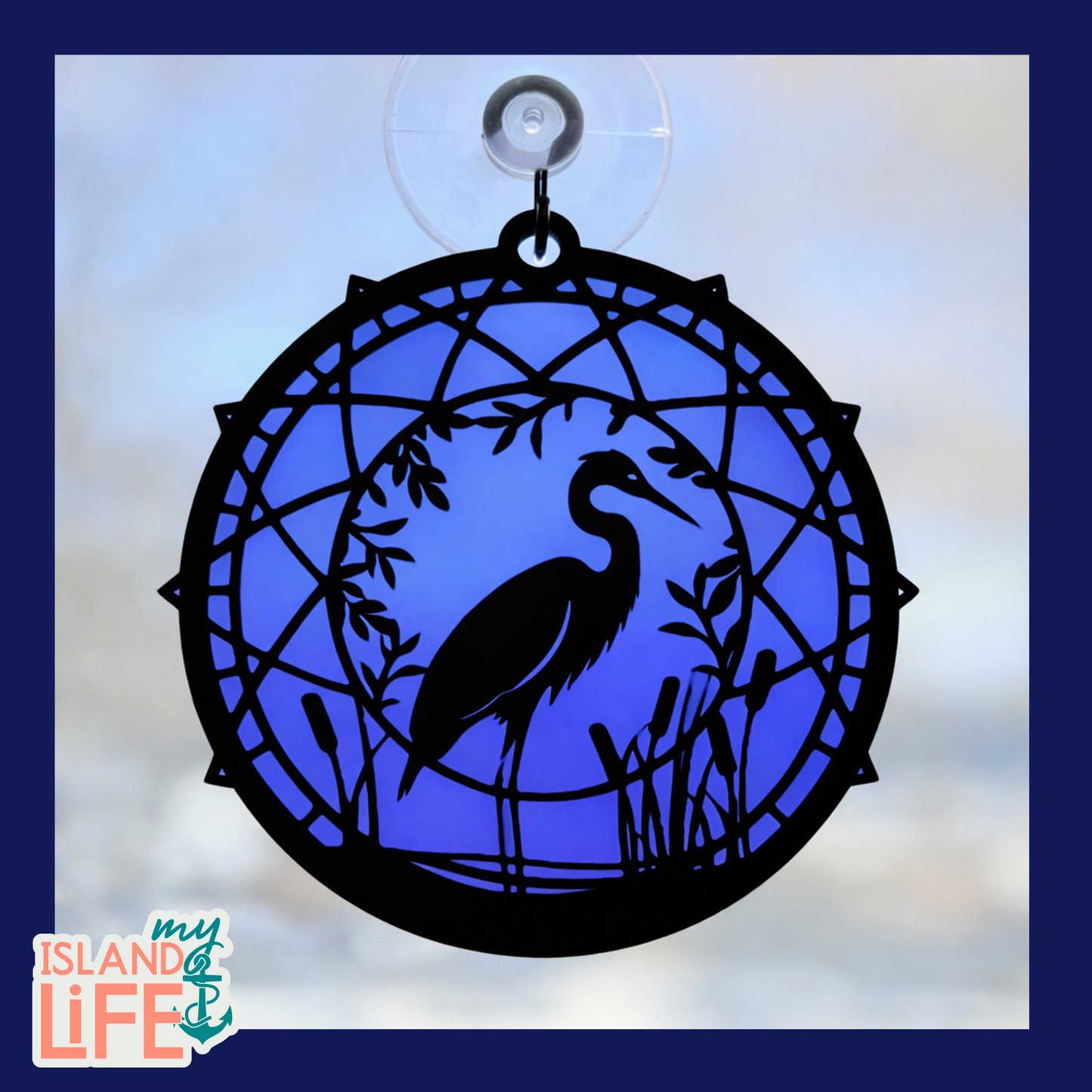 Decorative glass panel with a bird silhouette on a blue background, featuring 'my ISLAND LIFE' logo.