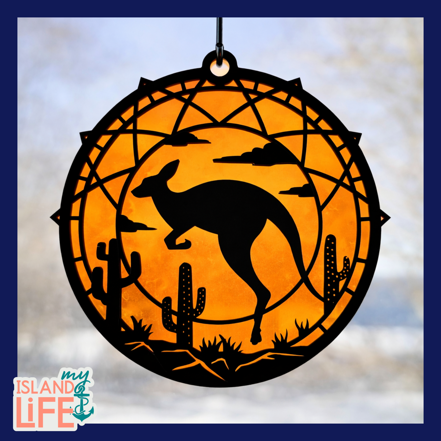 Decorative wall hanging with kangaroo silhouette and desert elements on an orange background, featuring 'My Island Life' logo.
