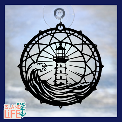 Decorative window hanging with lighthouse design on a cloudy sky background